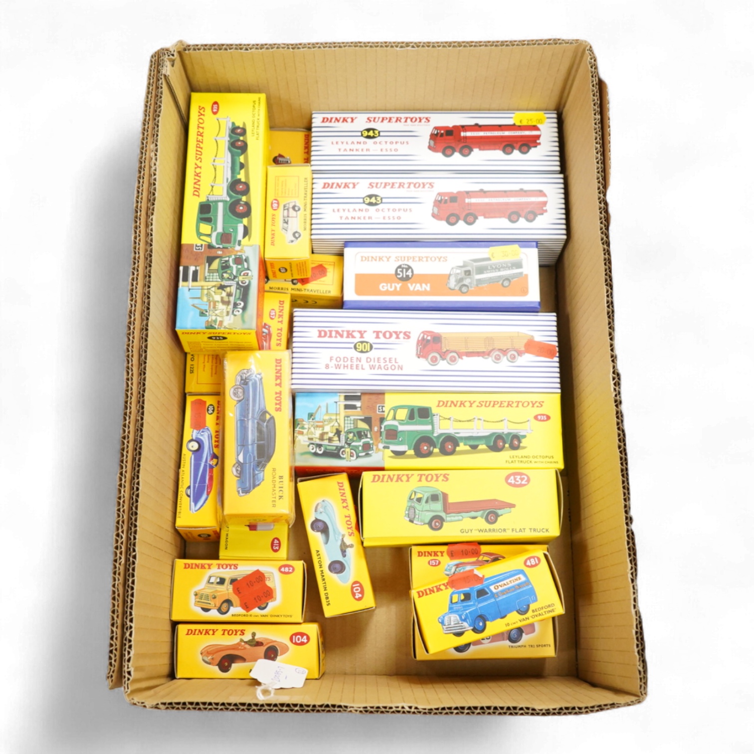 Twenty-two boxed Atlas Dinky Toys, including cars and commercial vehicles, Leyland tankers, a Foden wagon, sports cars, etc.